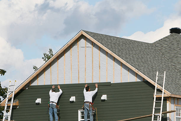 Professional Storm Damage Siding Repair technician working in South Vienna, OH